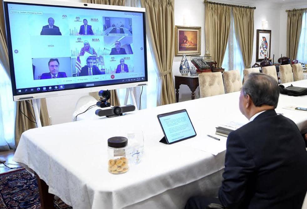 Prime Minister Muhyiddin Yassin in a virtual session attended by senior minister Mohamed Azmin Ali, Mida officials as well as those from AT&S, which announced its decision to set up a plant in Kedah. Photo: Facebook