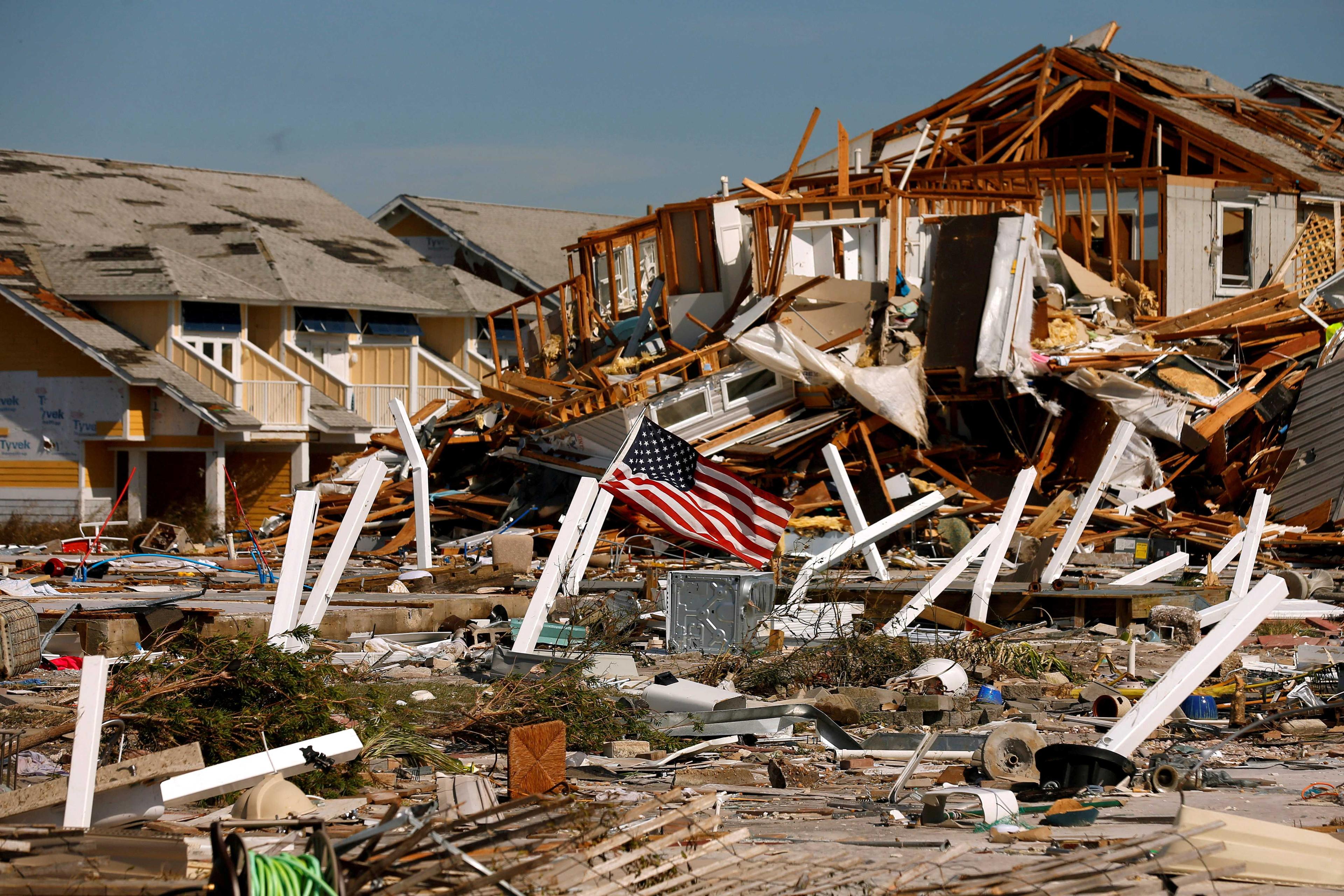 An American flag flies amongst rubble left in the aftermath of Hurricane Michael in Mexico Beach, Florida, US Oct 11. Photo: Reuters