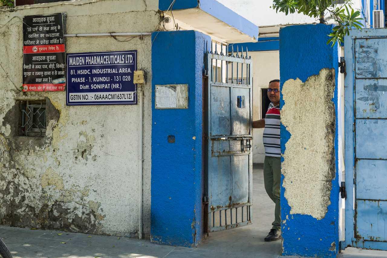 A security guard looks out of the front gate of a manufacturing unit of Maiden Pharmaceuticals group in Sonipat in Haryana state, on the outskirts of New Delhi on Oct 14. Photo: AFP
