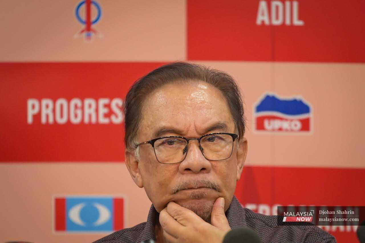 Anwar Ibrahim calls his critics 'criminals' who belong in prison.