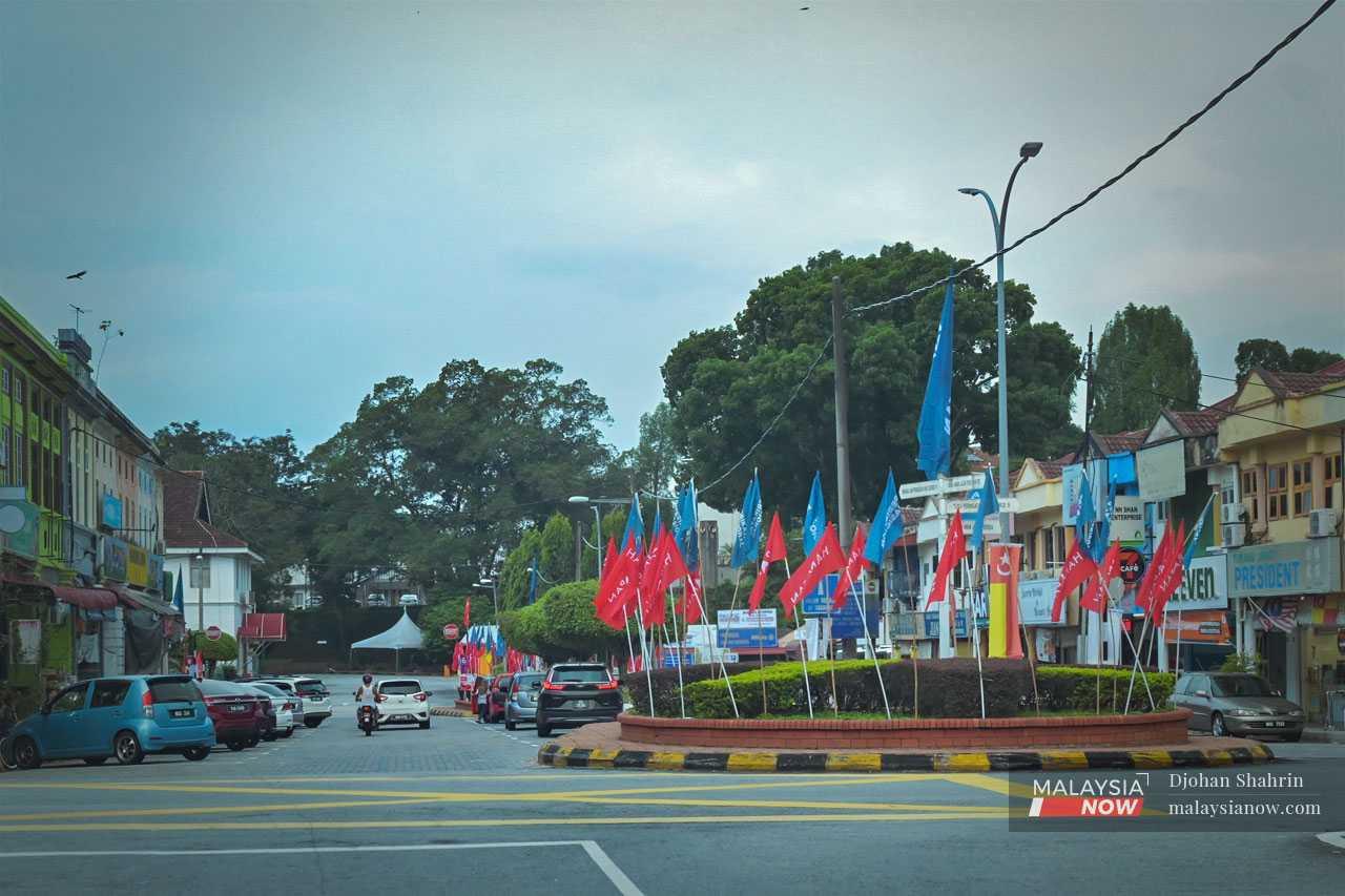 Pakatan Harapan and Perikatan Nasional flags dot a roundabout in Kuala Kubu Baharu, the district capital of Hulu Selangor where four opposing candidates are battling it out for the hearts and minds of voters ahead of this weekend's by-election.