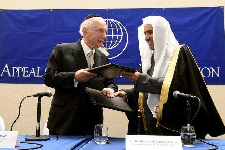 Mohammad Abdulkarim Al-Issa (right) with US rabbi Arthur Schneier, among pro-Zionist leaders with whom he shared the stage.