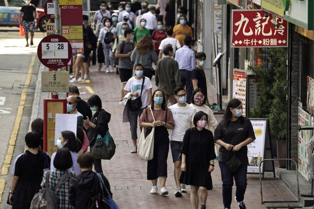 China reported 23 new domestic cases on Thursday, less than half of the previous day's number, in a sign that the country's tough disease controls may be working. Photo: AP