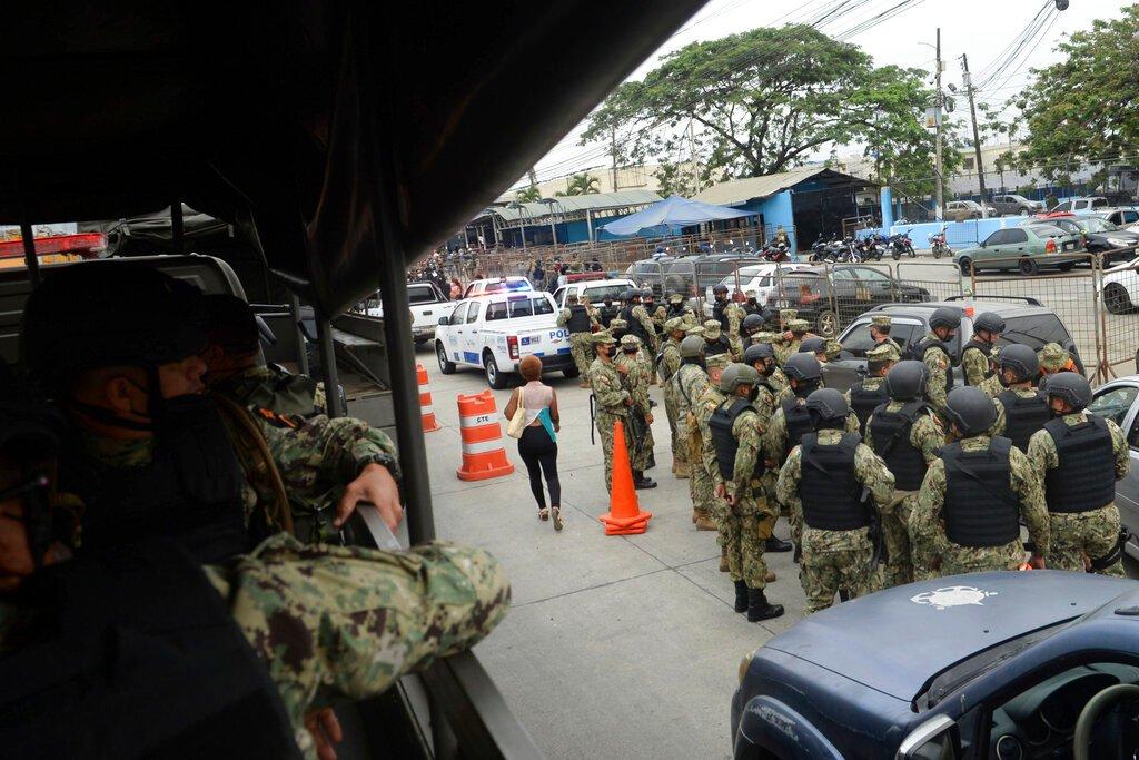Security forces arrive to Litoral Penitentiary the morning after riots broke out inside the jail in Guayaquil, Ecuador, Nov 13. More than 320 inmates have been killed so far in 2021, and the latest riot happened despite a state of emergency enforced in Ecuador's prison system after even deadlier fighting in September. Photo: AP