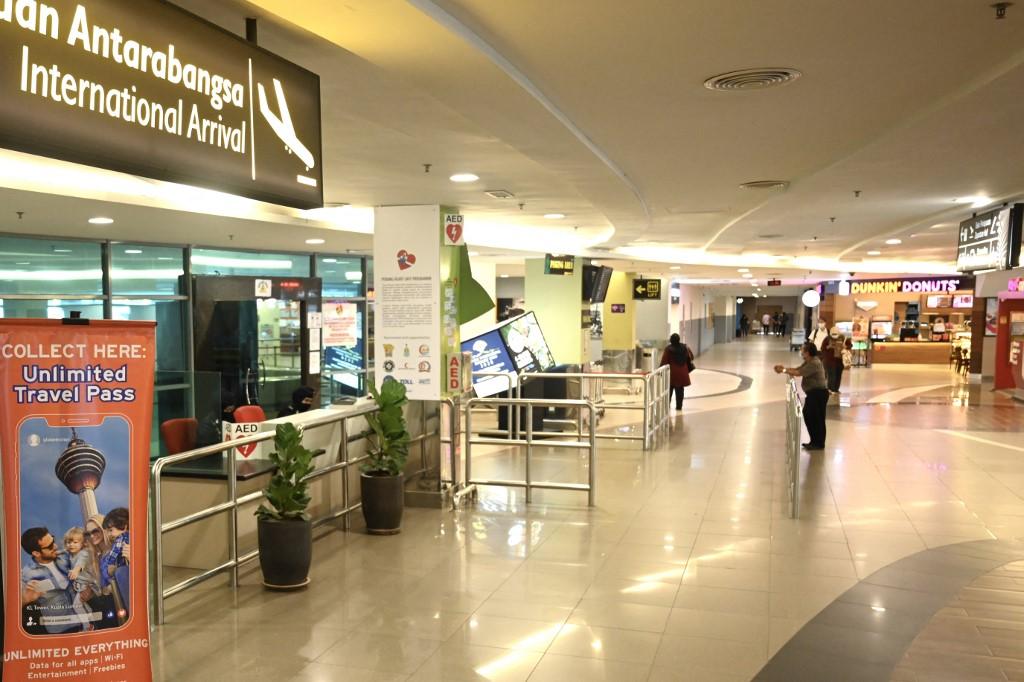 The near-deserted arrivals area of the Penang International airport is seen in Penang on March 17, 2020. Photo: AFP