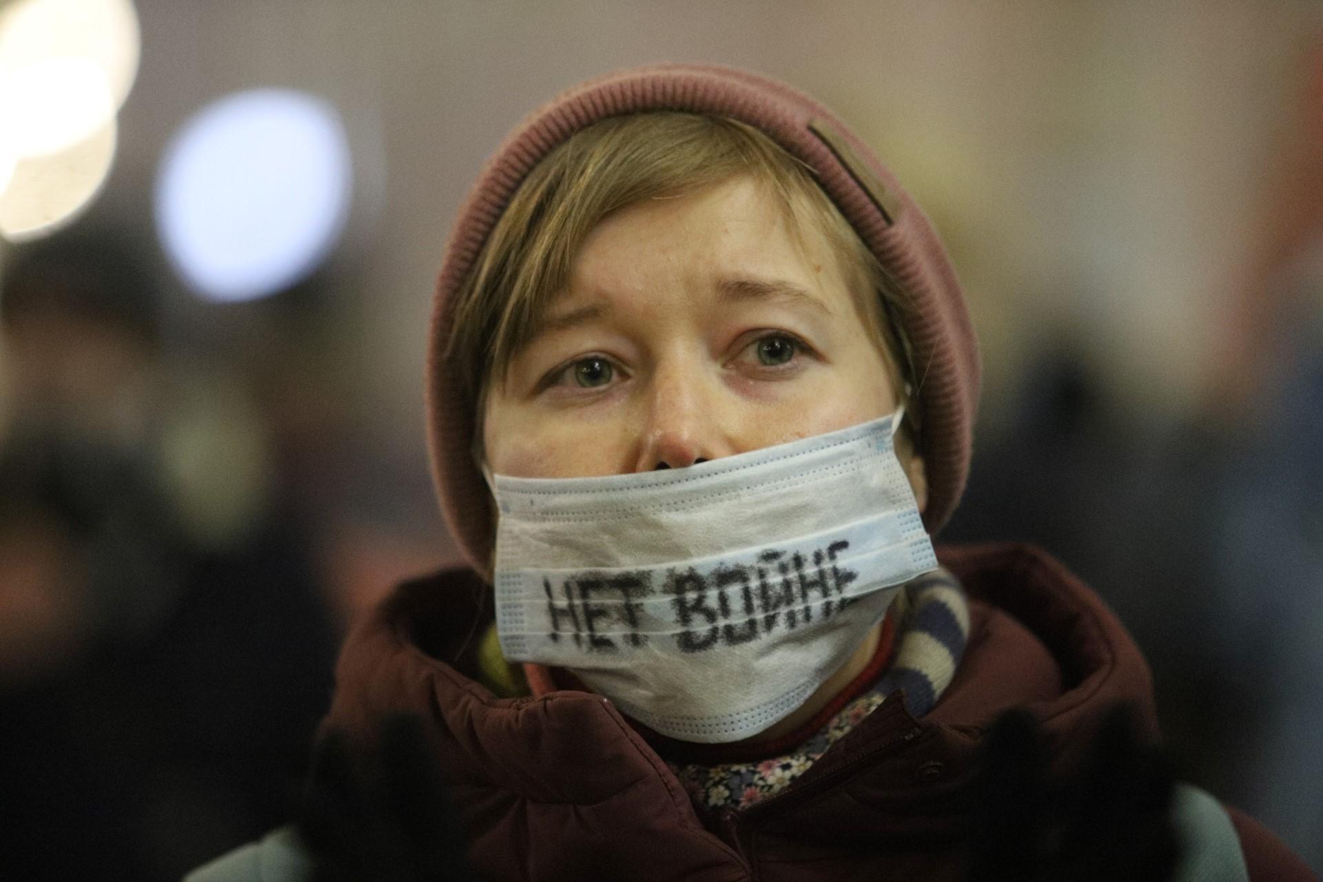 A demonstrator wearing a face mask with an inscription reading 'No to war' protests against Russia's invasion of Ukraine in central Saint Petersburg on Feb 24. Photo: AFP