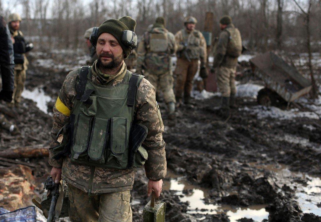 Servicemen of the Ukrainian Military Forces gather after the fighting against Russian troops and Russia-backed separatists near Zolote village, Lugansk region on March 6.