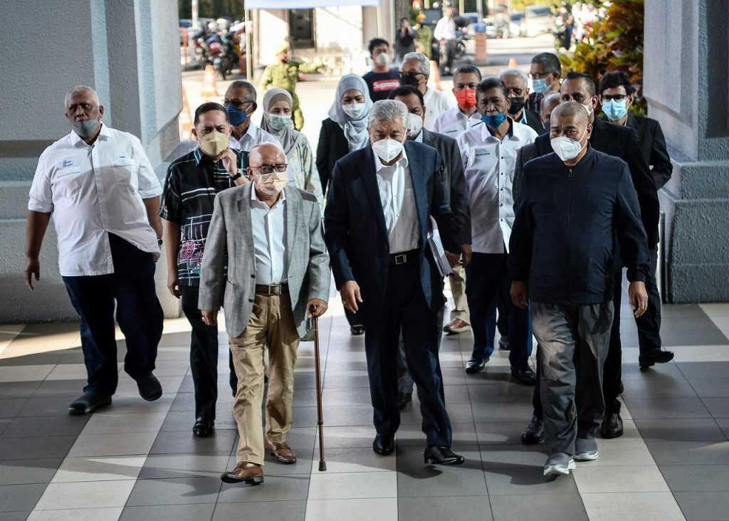 Former deputy prime minister Ahmad Zahid Hamidi (centre) at the Kuala Lumpur court complex. Photo: Bernama
