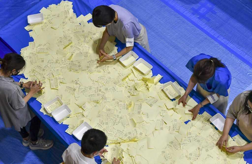 Officials of the election administration committee count the votes for Japan's upper house election in Tokyo on July 10. Photo: AFP