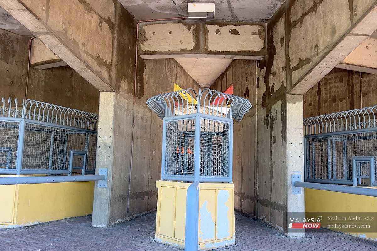 The ticket kiosks are locked up and abandoned. 
