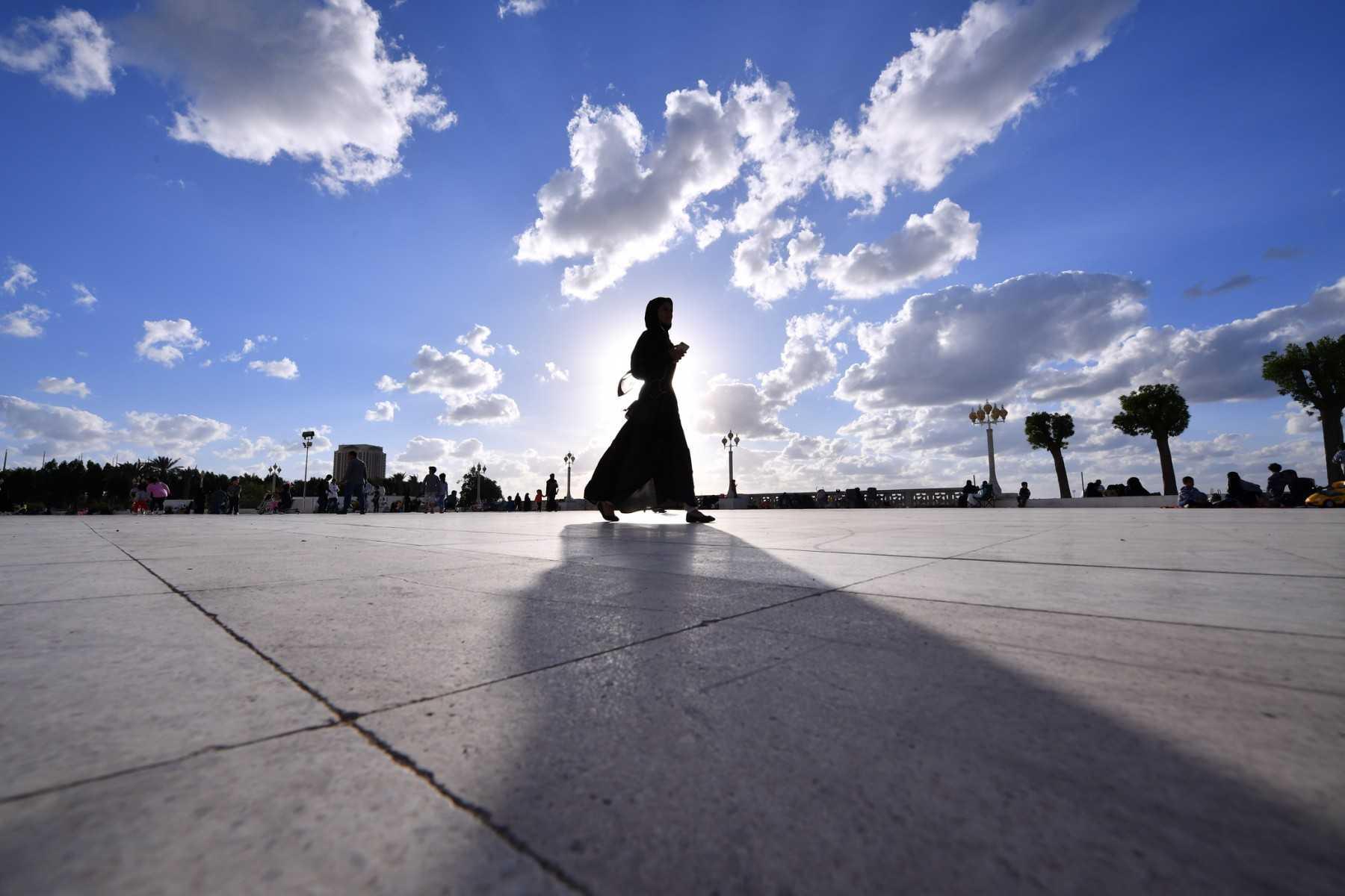A woman walks on the esplanade in front of the Hasan Anani mosque in the Saudi Arabian port city of Jeddah on Jan 10, 2020. Photo: AFP 