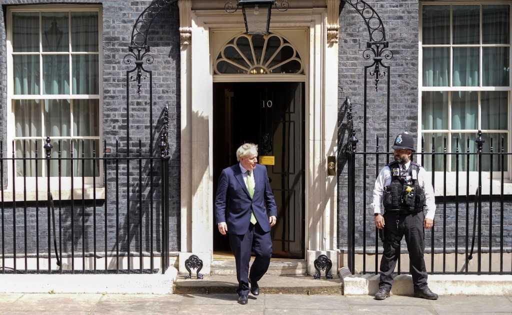A police officer looks on as Britain's Prime Minister Boris Johnson comes out of 10 Downing Street in central London on July 1. Photo: AFP