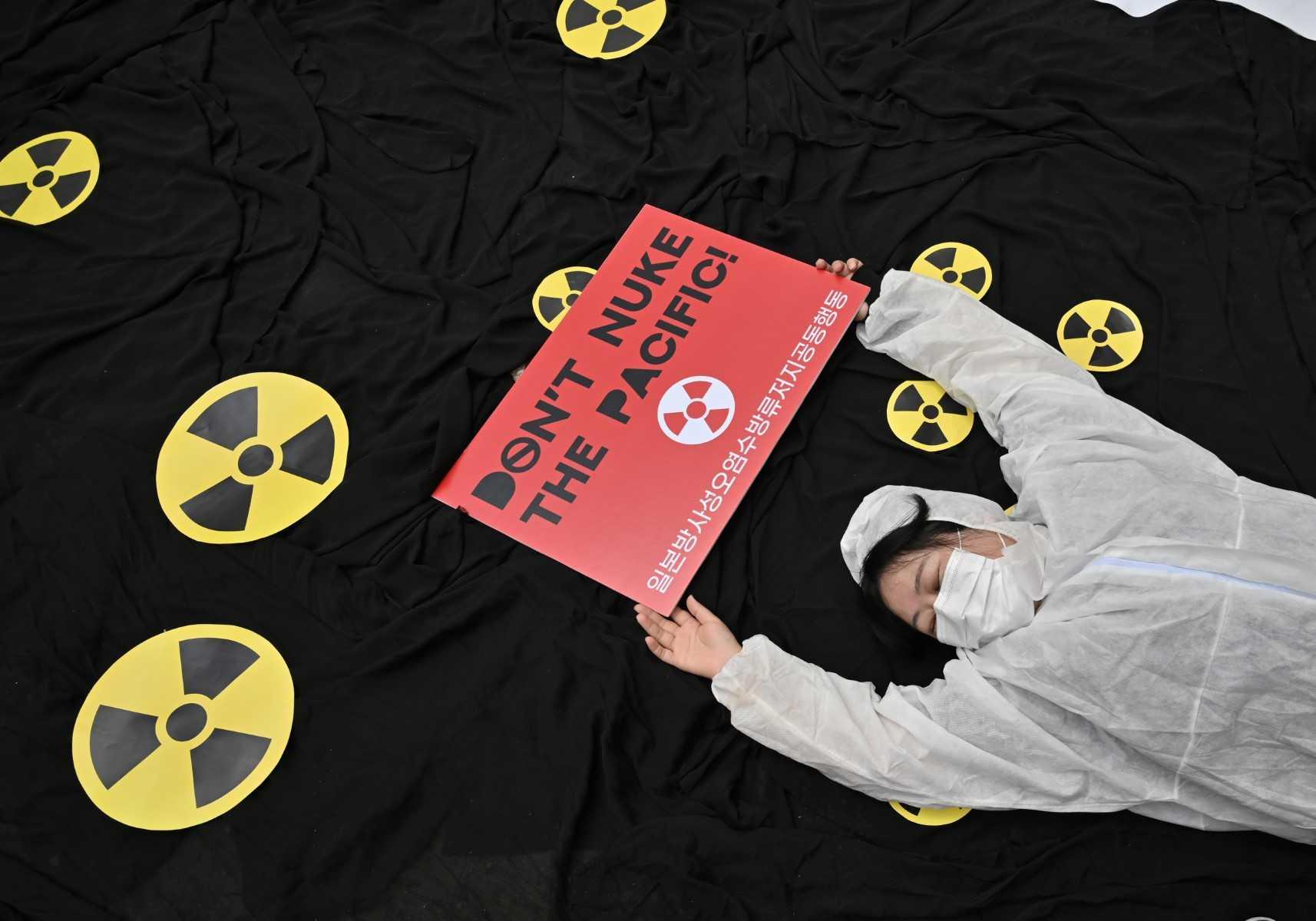 A South Korean environmental activist performs during a protest in Seoul against Japan's plan to discharge Fukushima radioactive water into the sea, as they mark World Oceans Day on June 8. Photo: AFP