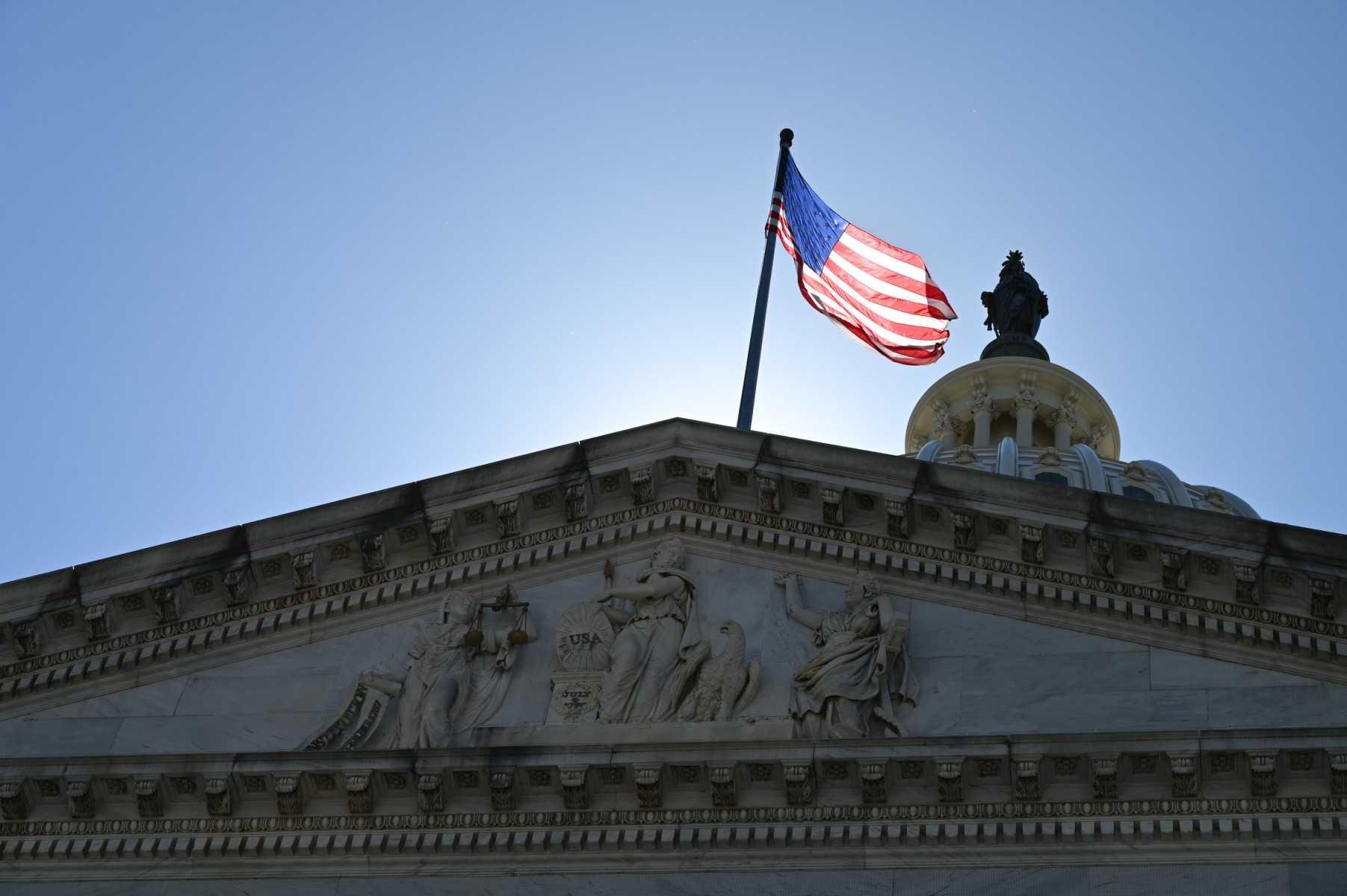 An American flag is seen on top of the US Capitol in Washington DC, on June 4. Photo: AFP