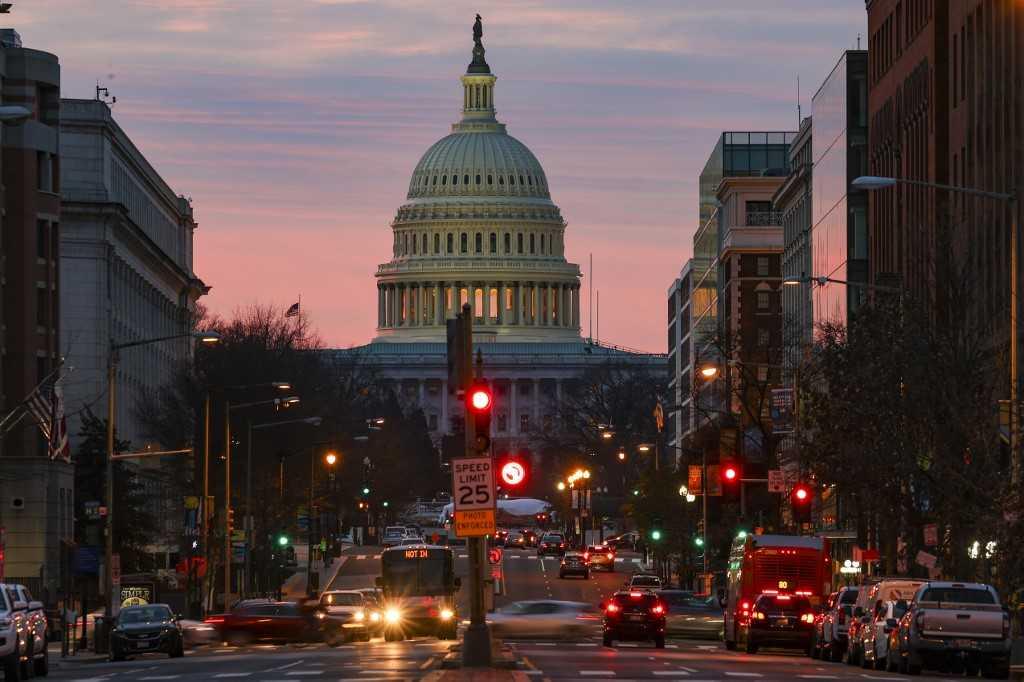 The sun rises over the US Capitol on Dec 28, 2020 in Washington, DC. Photo: AFP