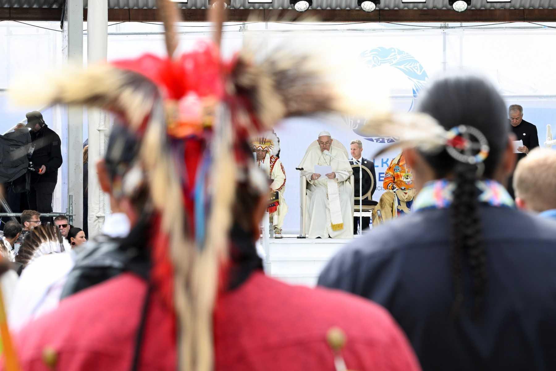 This handout picture taken and released on July 25 by the Vatican press office shows Pope Francis (centre) talking during a meeting with members of the indigenous community at Muskwa Park in Maskwacis, south of Edmonton, western Canada, on July 25. Photo: AFP