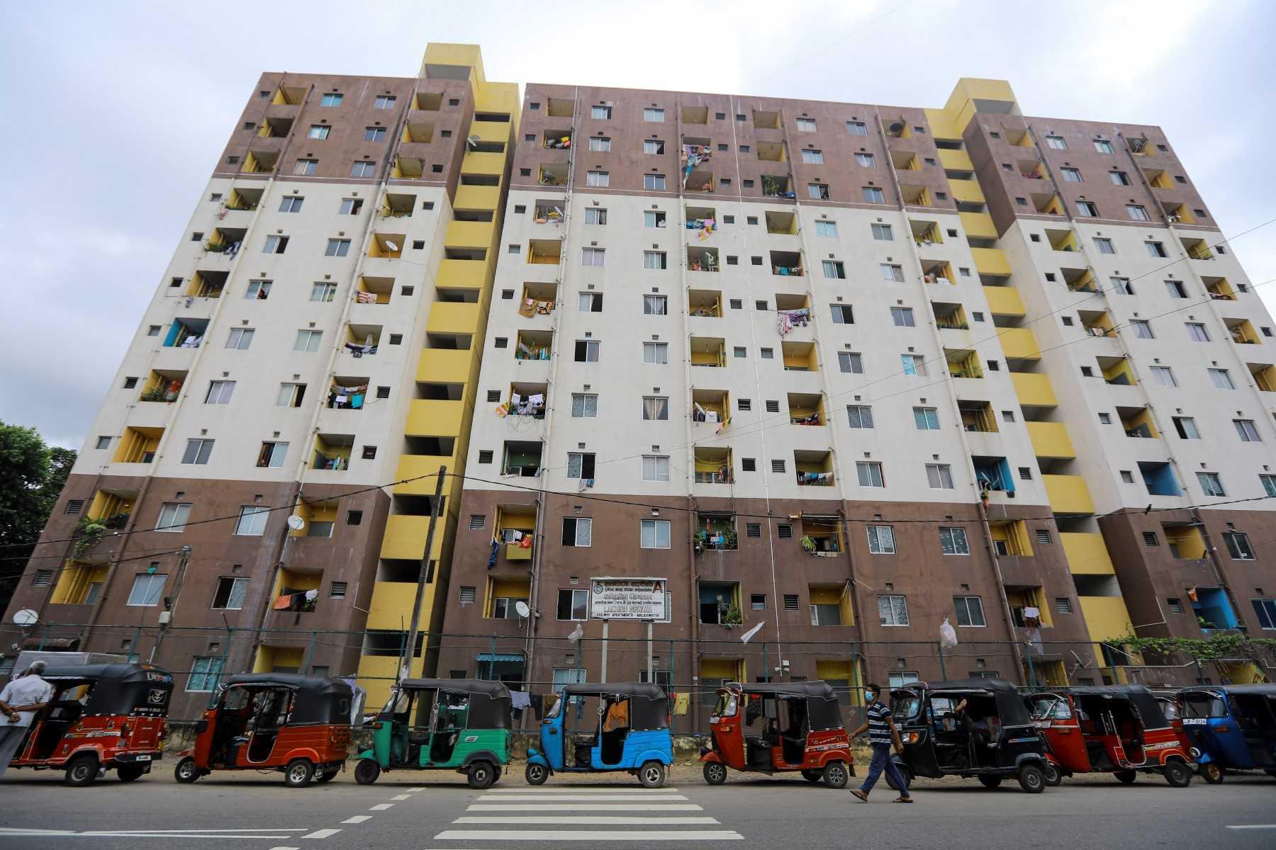 Autorickshaw drivers queue along a street to buy petrol from a Ceylon petroleum corporation fuel station in Colombo on June 15. Photo: AFP