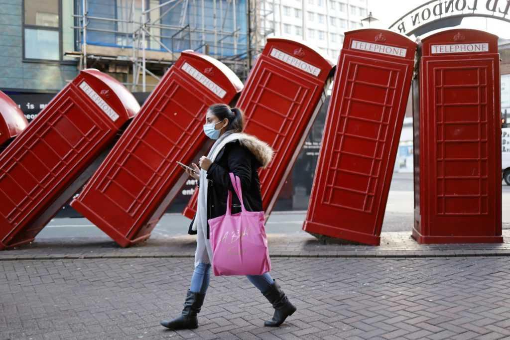 A shopper passes a piece of street art in south west London on Jan 9. Photo: AFP