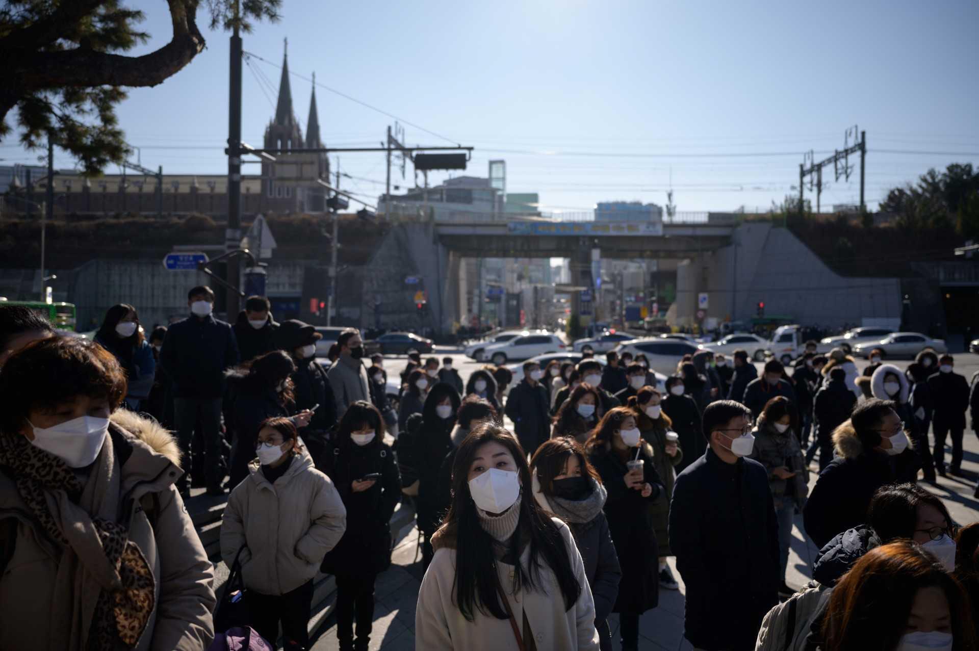 Parents wait for their children in Seoul on Dec 8, 2020. Photo: AFP