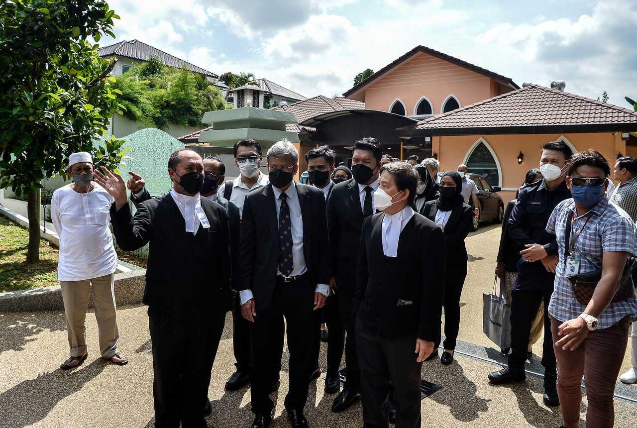 High Court judge Collin Lawrence Sequerah (centre) visits one of the bungalows in Country Heights, Kajang allegedly bought with funds from Yayasan Akalbudi. Photo: Bernama