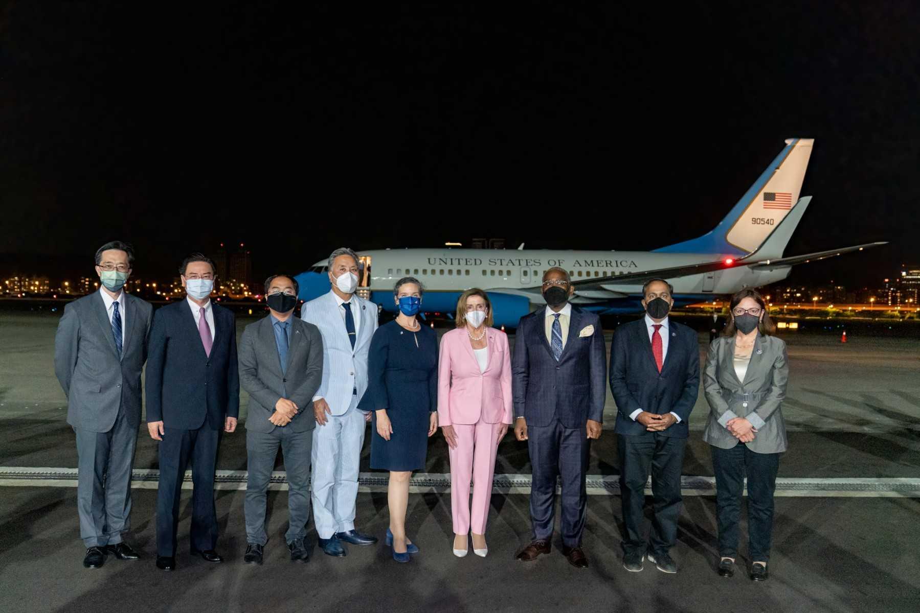 This handout picture taken and released by Taiwan’s foreign affairs ministry on Aug 2, shows Speaker of the US House of Representatives Nancy Pelosi posing with her delegation upon their arrival at Sungshan Airport in Taipei. Photo: AFP