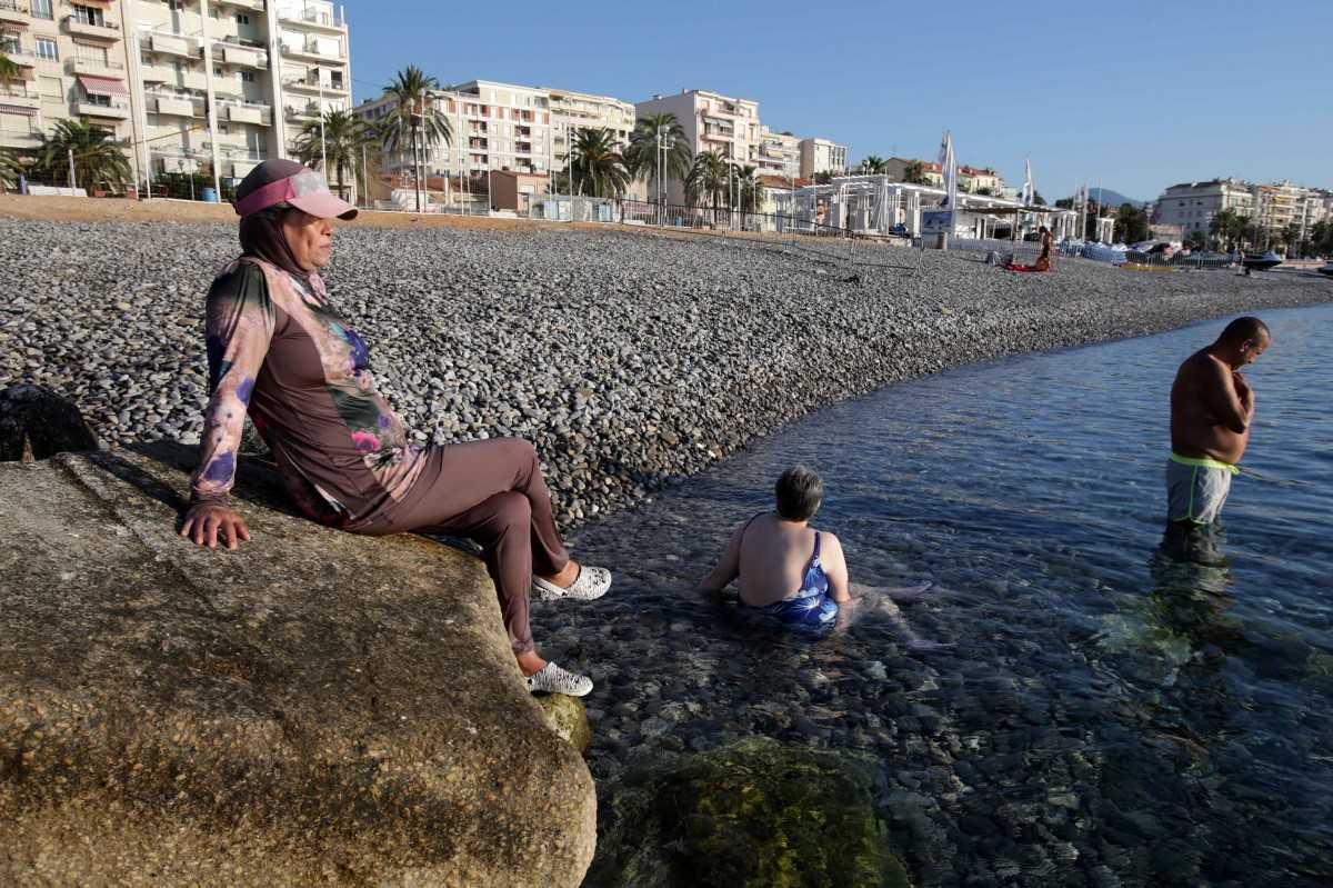 A French woman wears a burkini as she sunbathes on the beach of Carras, in the city of Nice, southeastern France, on Aug 26, 2016. Photo: AFP
