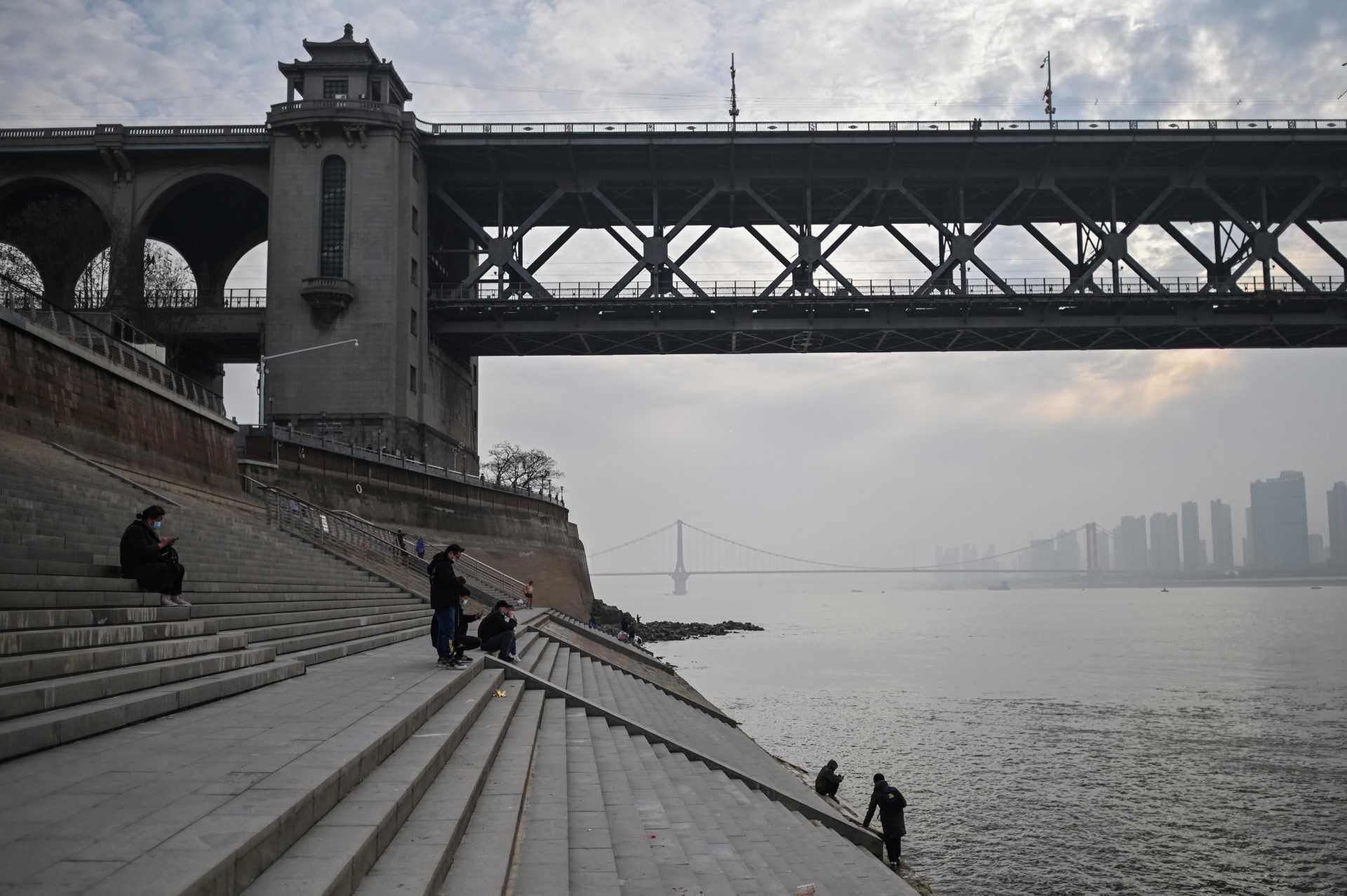 People visit the riverbank of the Yangtze River in Wuhan, China's central Hubei province on Feb 2, 2021. Photo: AFP 