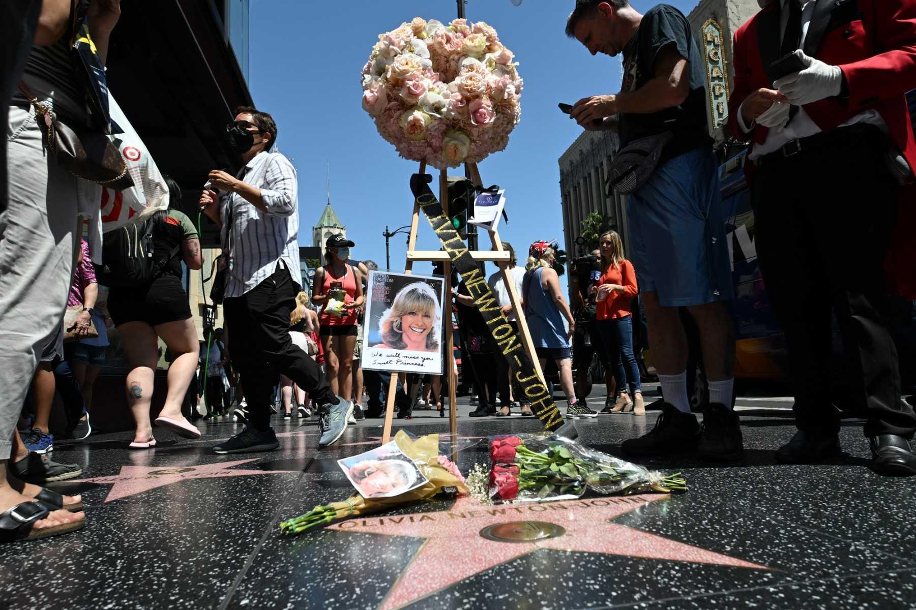 Flowers and photos are seen on the star of Australian singer and actress Olivia Newton-John on the Hollywood Walk of Fame in Hollywood, California, on Aug 8. Photo: AFP