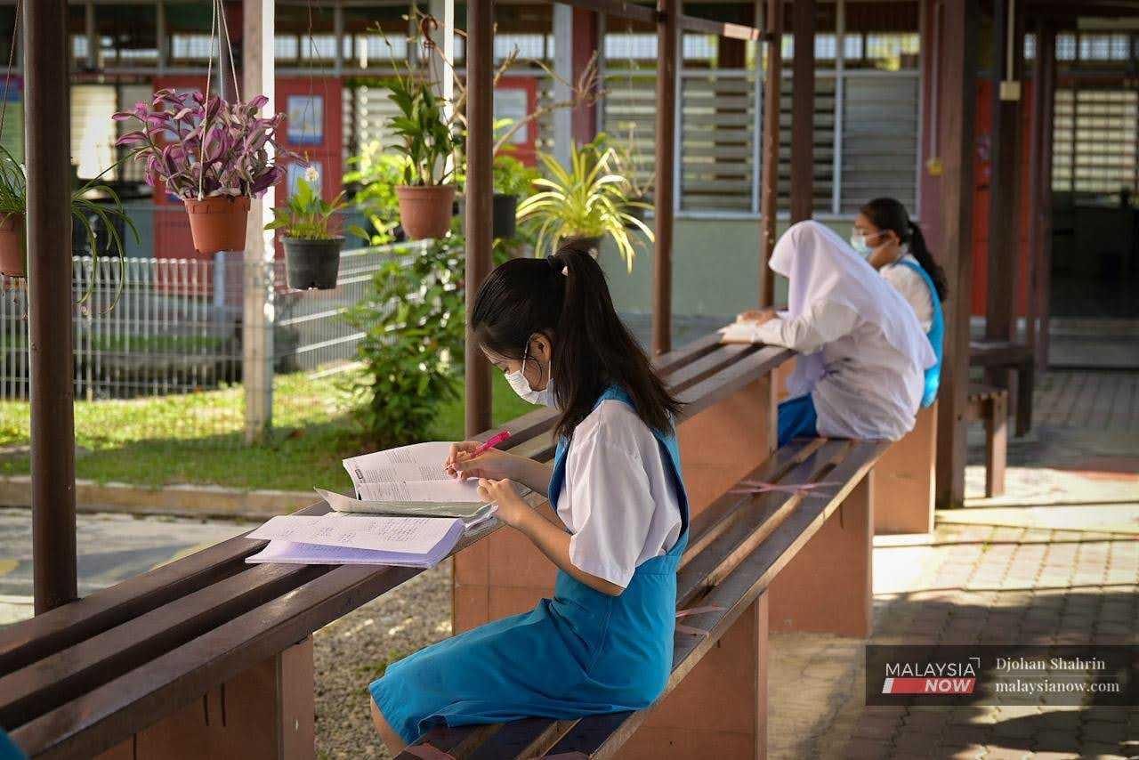 Students do their homework at a secondary school in Petaling Jaya, Selangor. 