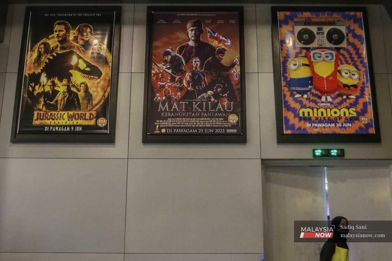 A poster for local blockbuster 'Mat Kilau: Kebangkitan Pahlawan' hangs at a cinema in Putrajaya. 'Mat Kilau' has collected more than RM96 million in the country since it began screening. 