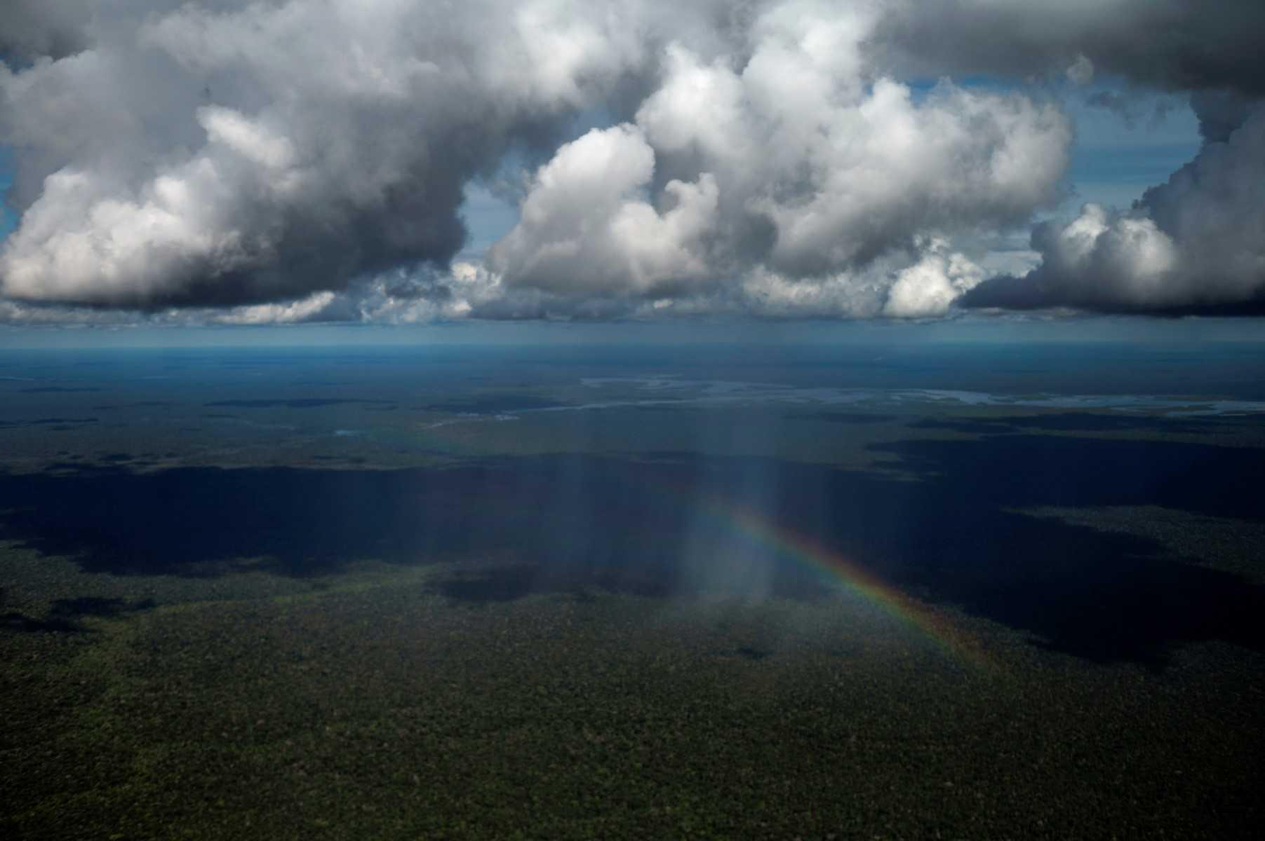 An aerial view shows a rainbow over the Amazon rainforest, taken from a plane flying from the city of Manicore to Manaus, Amazonas state, Brazil, on June 10. Photo: AFP