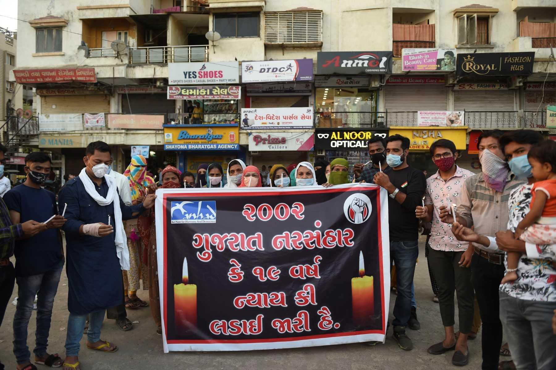 People participate in a candlelight vigil to commemorate the 19th anniversary of the Gujarat riots of 2002, in Ahmedabad on Feb 28, 2021. Photo: AFP