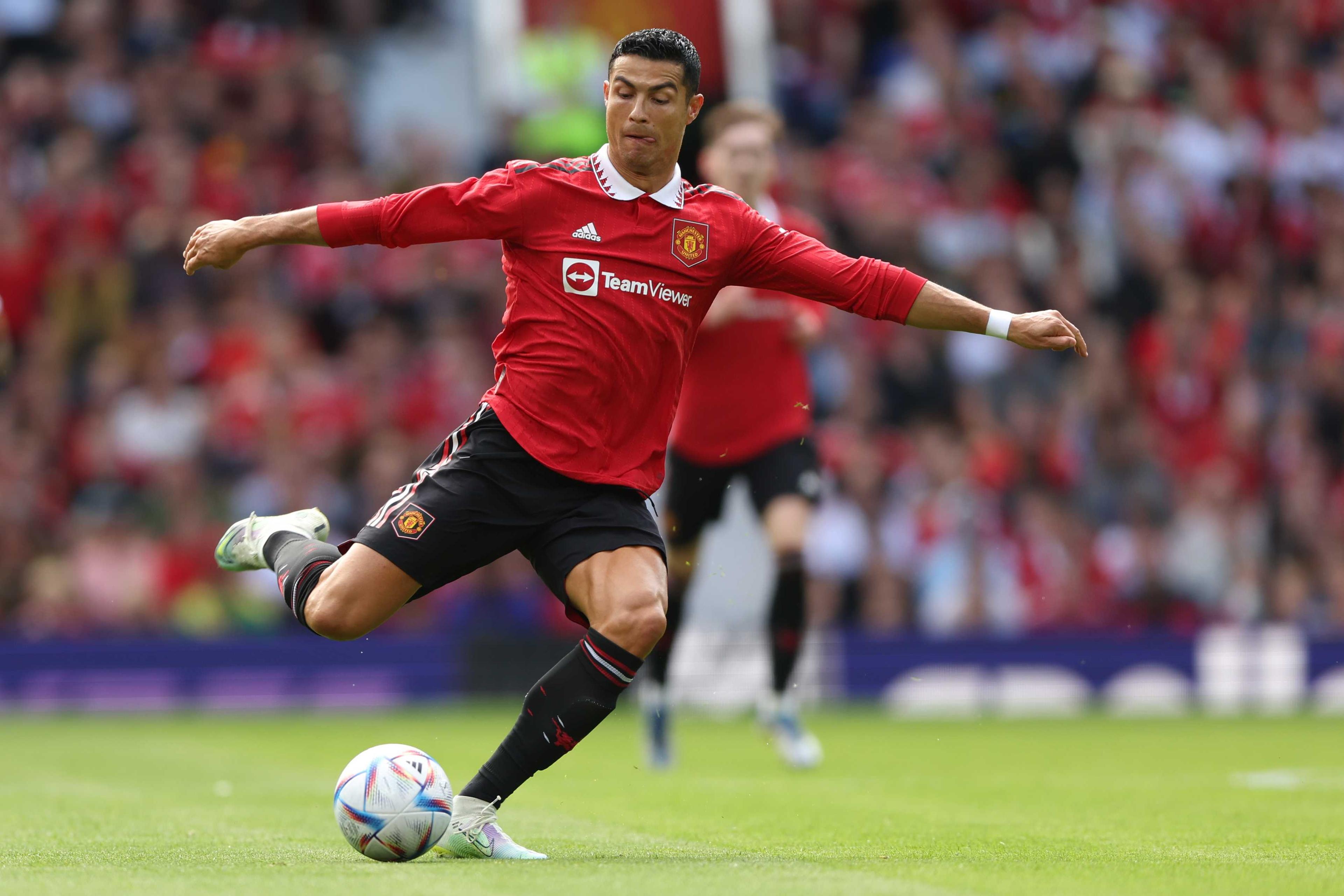 Manchester United's Portuguese striker Cristiano Ronaldo passes the ball during a pre-season club friendly football match between Manchester United and Rayo Vallecano at Old Trafford in Manchester, north west England, on July 31. Photo: AFP 