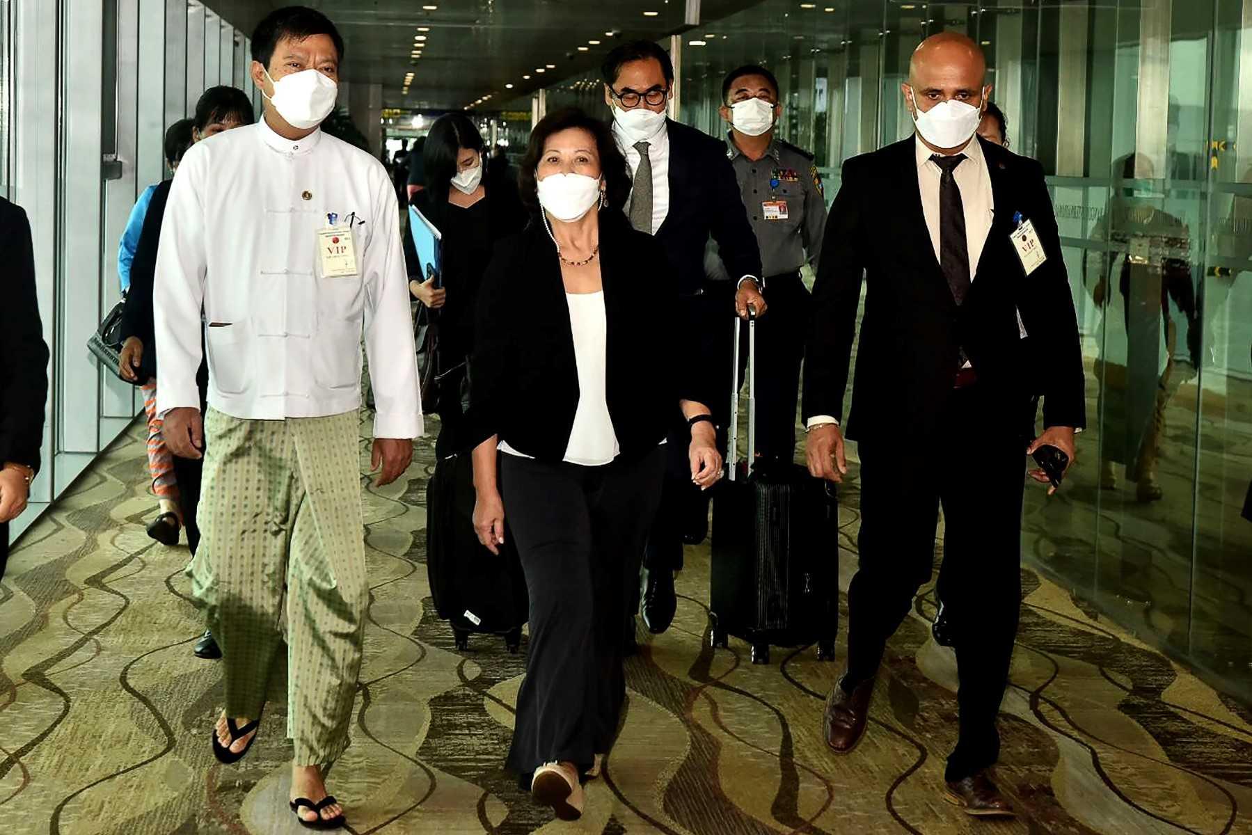 This handout photograph taken and released on Aug 16, by Myanmar’s military information team shows United Nations special envoy on Myanmar Noeleen Heyzer (centre) walking with high-level officials following her arrival at the airport in Yangon. Photo: AFP