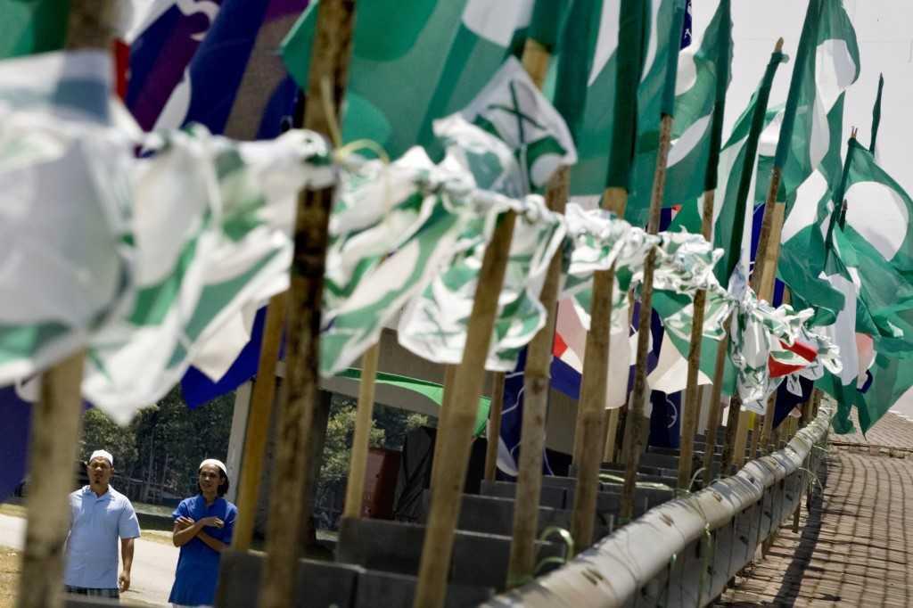 PAS says there is a need for cooperation between Barisan Nasional and Perikatan Nasional, but that it is ready to go against BN if no such ties are formed. Photo: AFP
