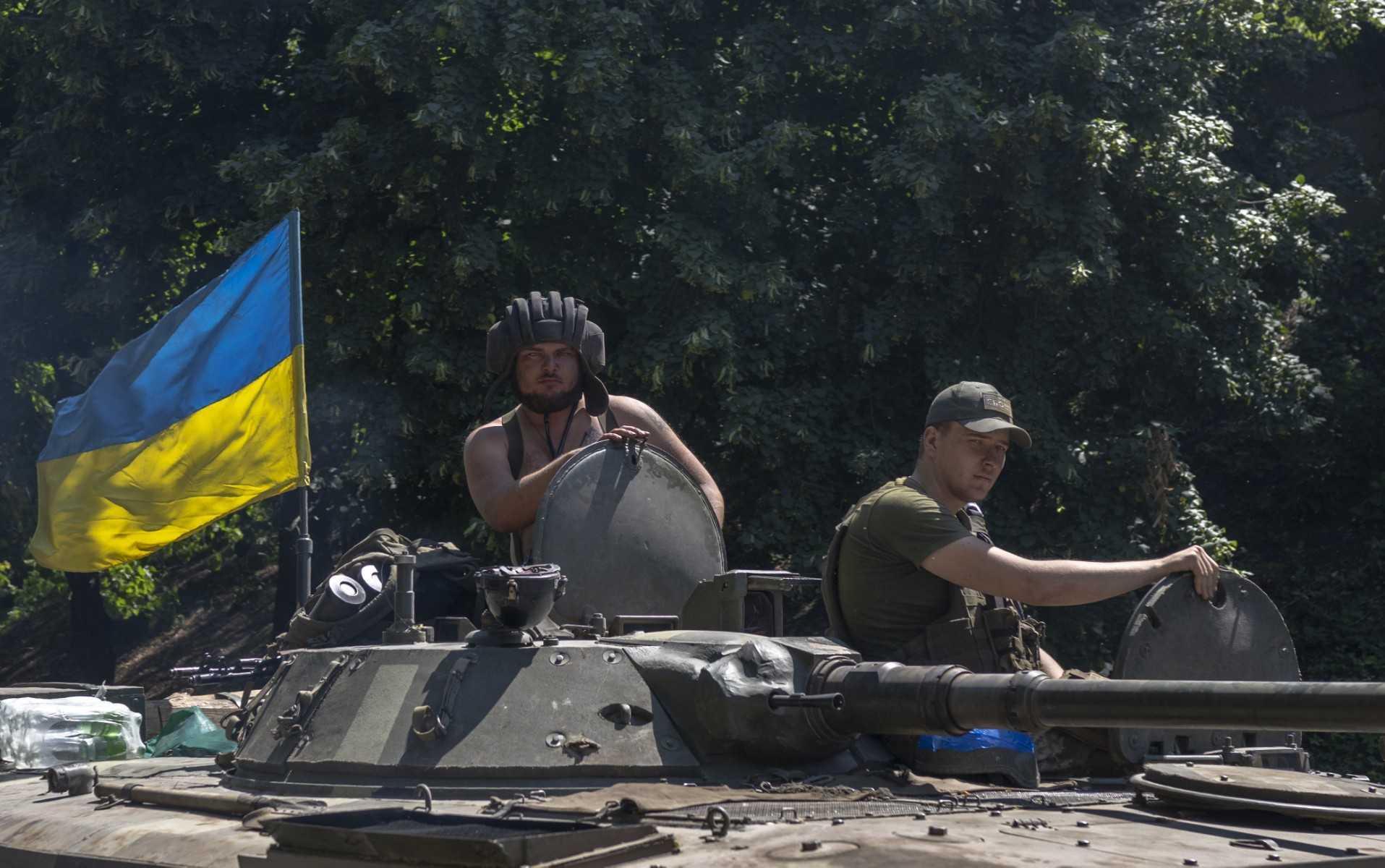 Ukrainian soldiers drive to the front line, eastern Ukraine, on July 31. Photo: AFP 
