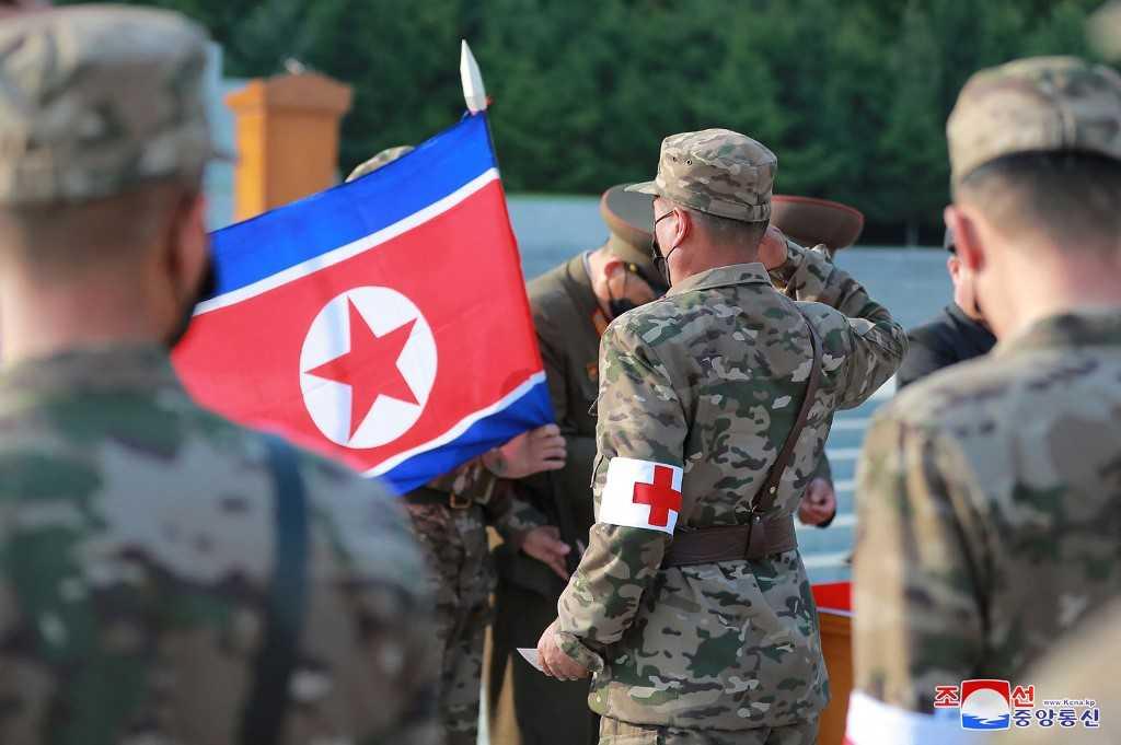 This picture taken on May 16 and released from North Korea's official Korean Central News Agency on May 17 shows officers of the military medical field of the Korean People's Army going to supply medicines to resolve the epidemic prevention crisis over the spread of Covid-19, in Pyongyang. Photo: AFP