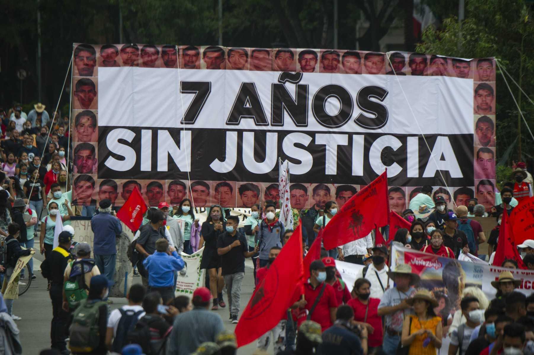 People hold a banner reading '7 years without justice' during a protest in Mexico City on Sept 26, 2021. Photo: AFP