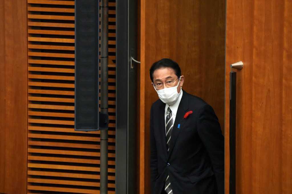 Japan's Prime Minister Fumio Kishida walks in for a news conference at the prime minister's official residence in Tokyo on Oct 14. Photo: AFP