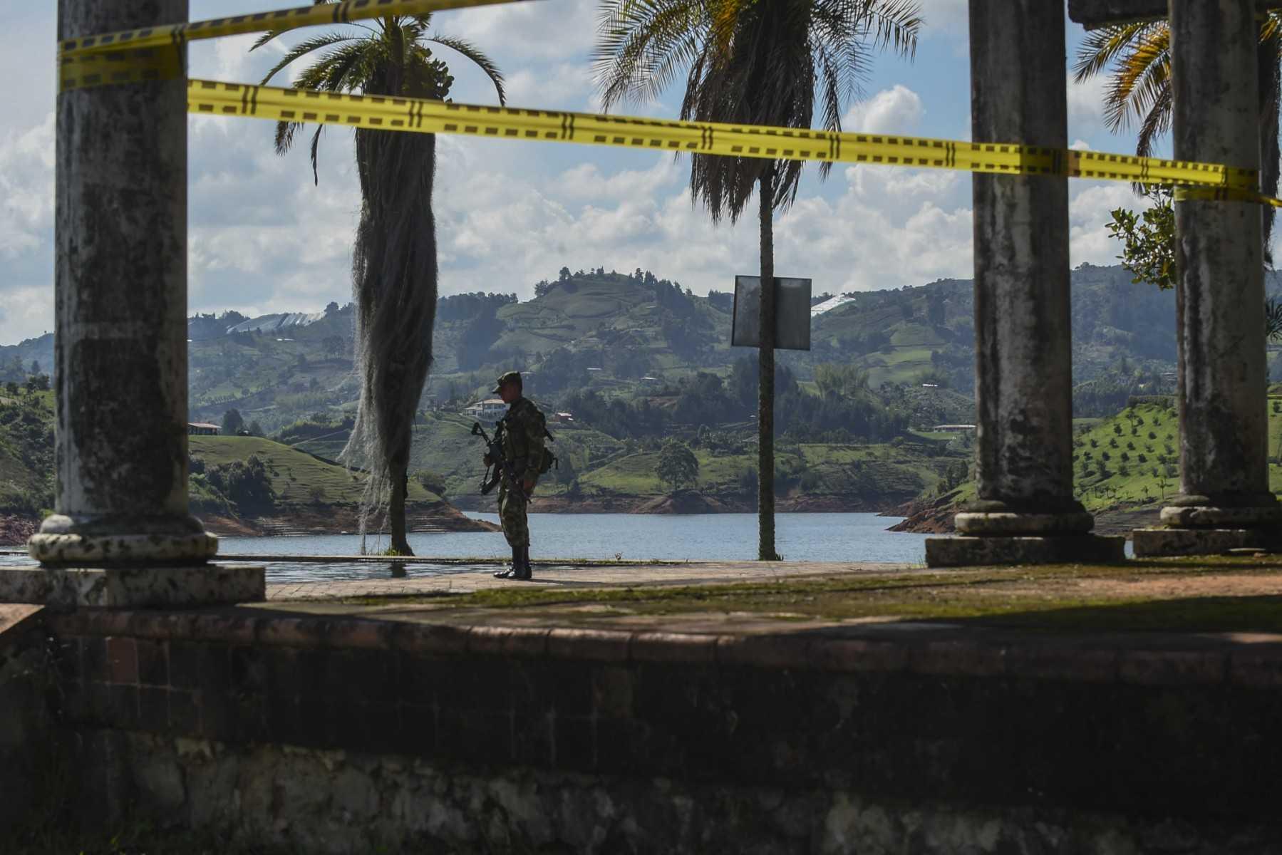 A soldier stands guard at 'La Manuela', a former vacation estate of late drug kingpin Pablo Escobar's family, on El Penol reservoir, in the municipality of the same name near the town of Guatape, east of Medellin, Colombia, taken on April 11, 2019. Photo: AFP