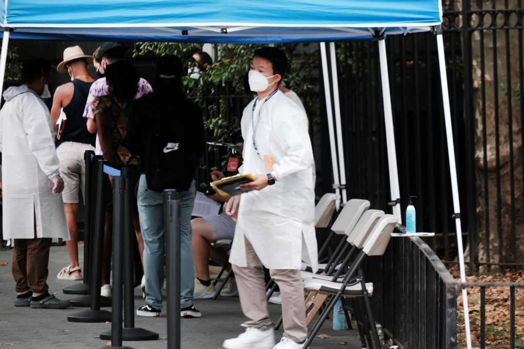 Healthcare workers with New York City Department of Health and Mental Hygiene work at intake tents where individuals are registered to receive the monkeypox vaccine on July 29 in New York City. Photo: AFP