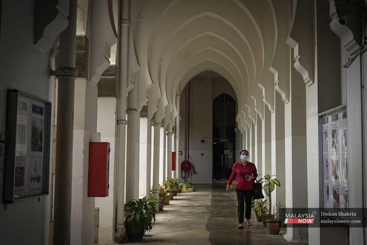 A member of the KTMB staff walks through a corridor in the administration building.