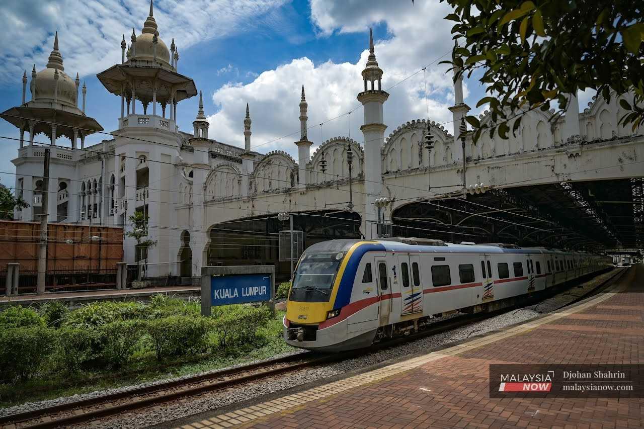 Another commuter train leaves the station, heading towards Port Klang. 