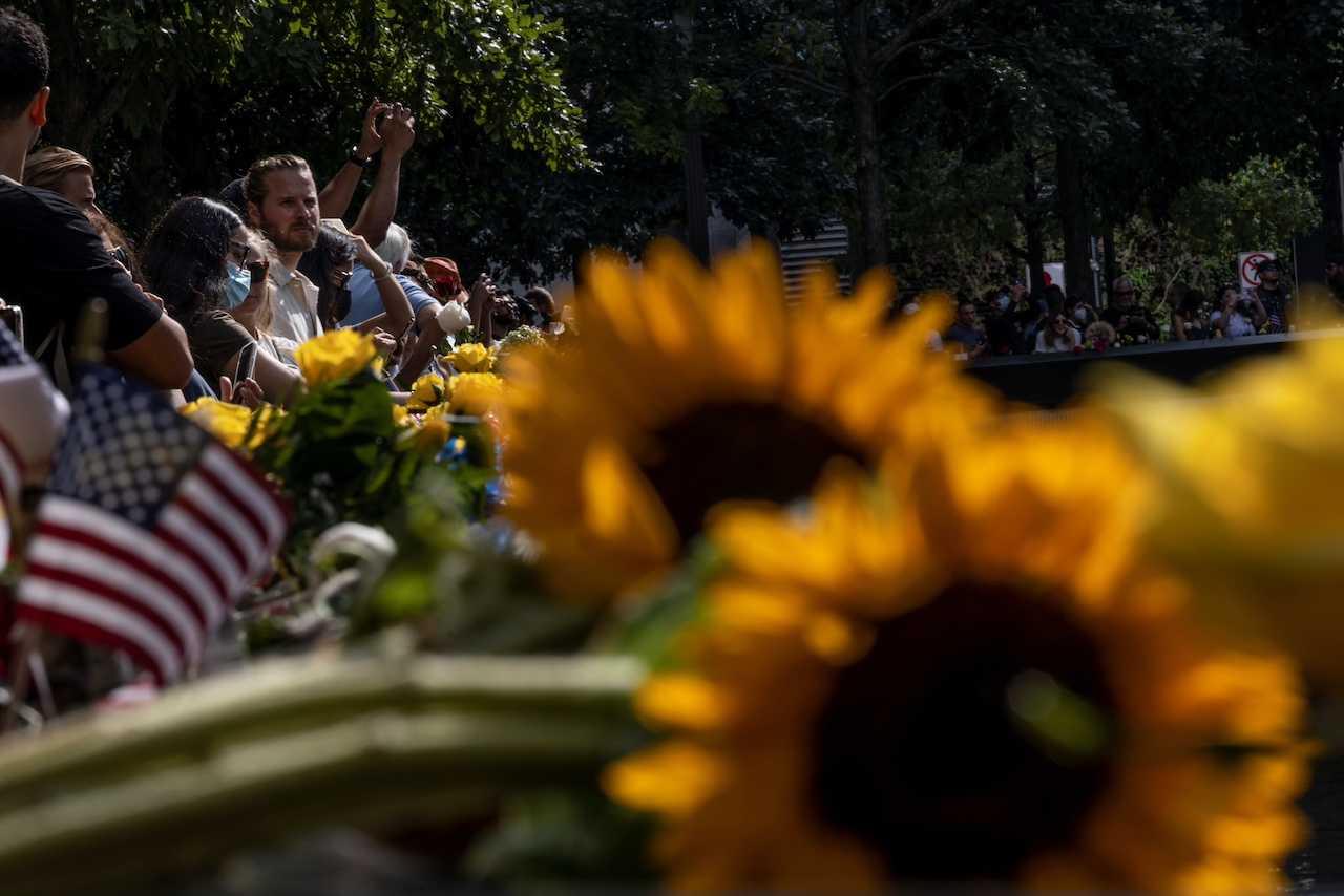 People gather at the 9/11 Memorial on the day marking the 20th anniversary of the Sept 11, 2001 attacks in New York City, New York, Sept 11, 2021. Photo: Reuters