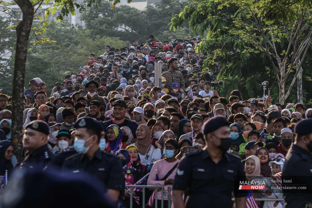 Crowds gather at Dataran Merdeka to watch the parade. 