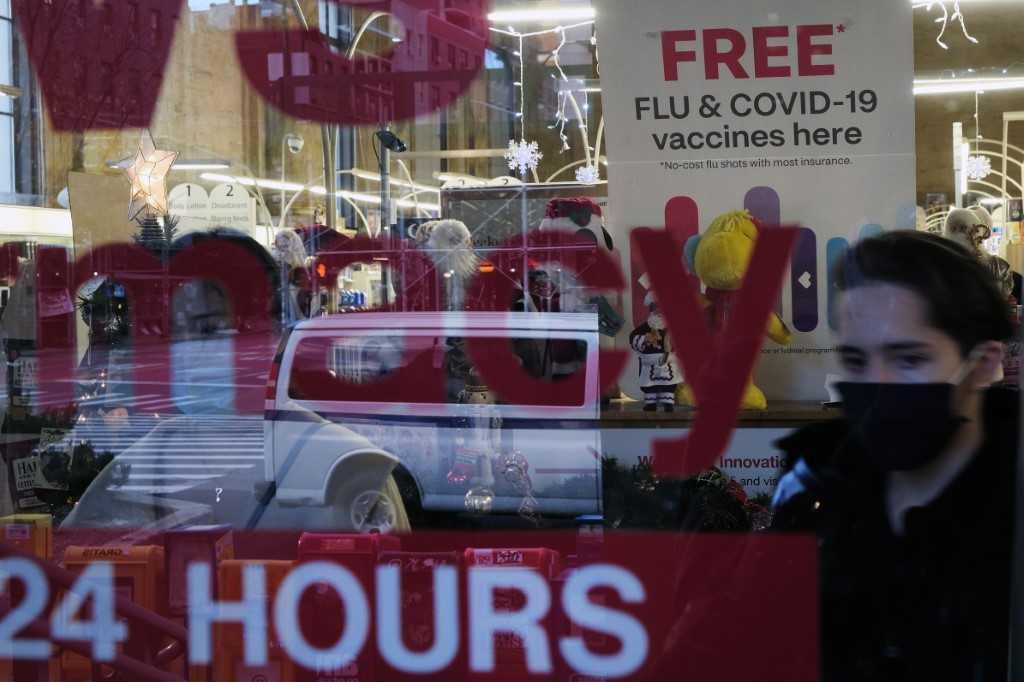 A sign at a drug store advertises the Covid-19 vaccine on Nov 19, 2021 in New York City. Photo: AFP