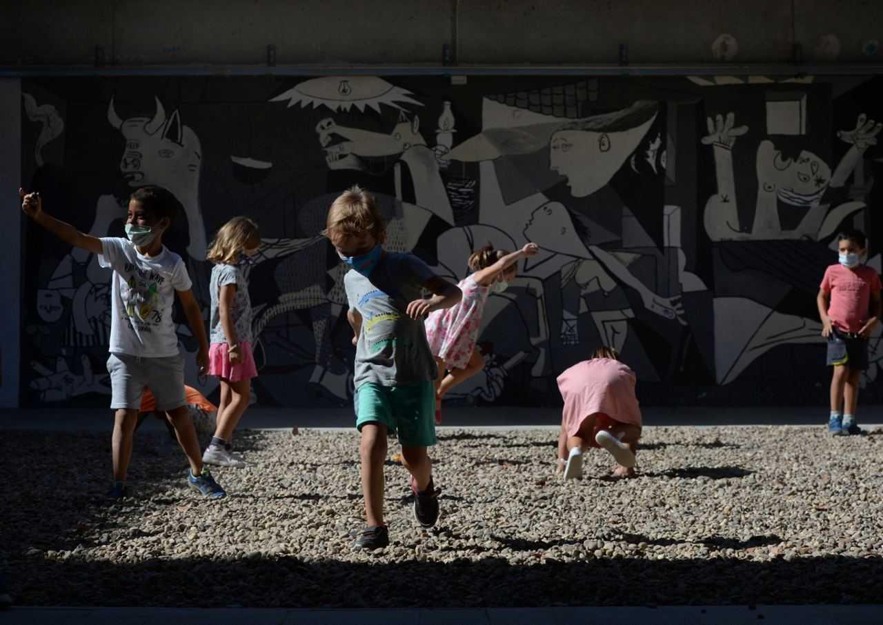 Children play at the playground of a school in Mairena del Aljarafe, near Seville. A 20-month-old girl has died after being struck on the head during a violent hailstorm that caused havoc in Catalonia, northeastern Spain. Photo: AFP