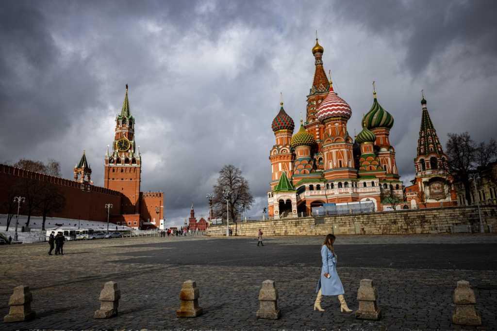 A woman walks outside the Kremlin, Red Square and St Basil's Cathedral in central Moscow on Feb 22. Moscow calls its intervention in Ukraine 'a special military operation'. Photo: AFP