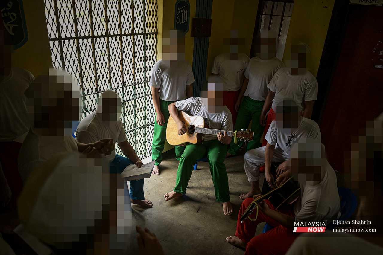A group of drug offenders practise for a singing competition with inmates in other prisons throughout the country. 