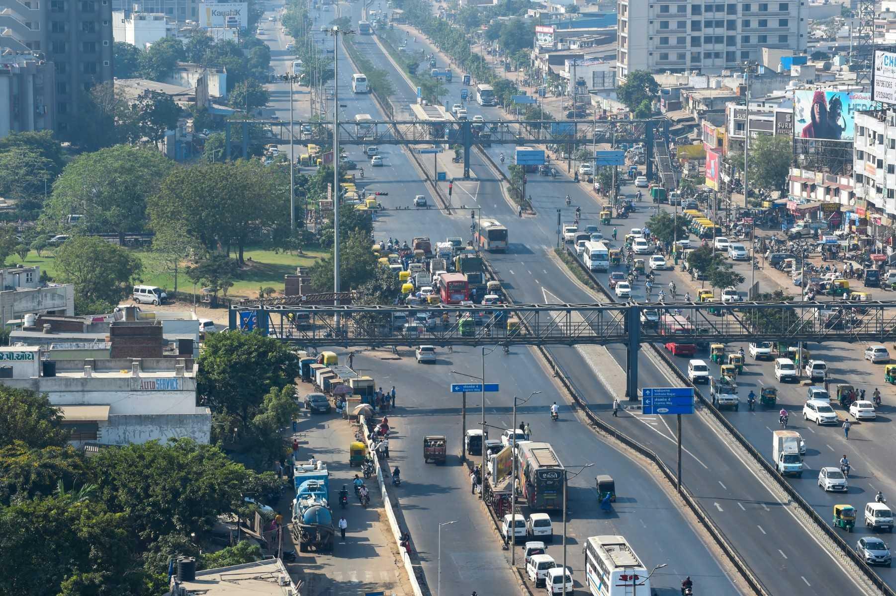 Vehicles are seen driving along streets in Ahmedabad on Dec 8, 2020. Photo: AFP